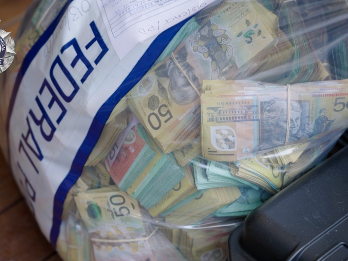 Bundled Australian bank notes in an AFP evidence bag