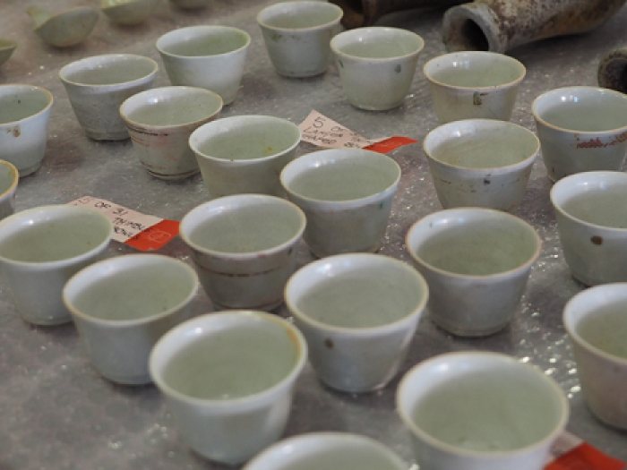 White ceramic cups on a table.