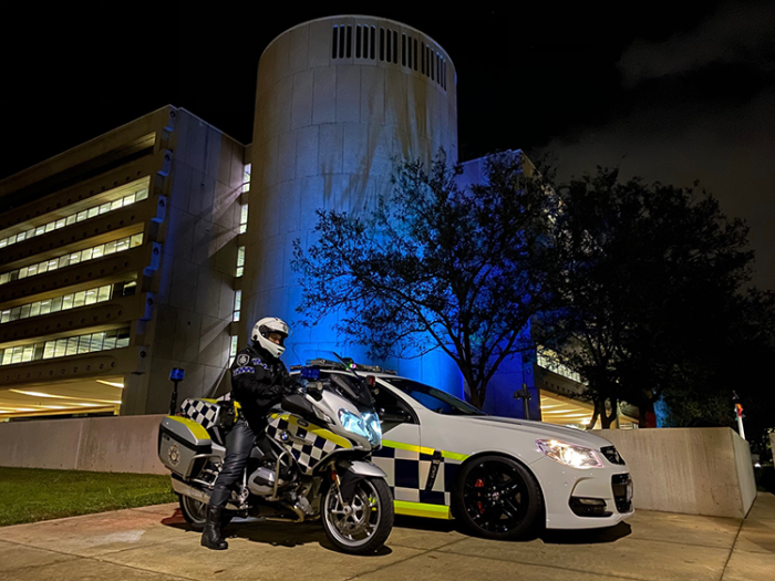 Police car and motorbike outside AFP National Headquarters 