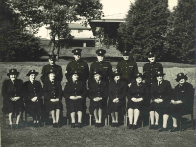 Members of the Defence Establishment Guard circa 1940, including 9 women seated in the front row (AFP MRN 12934)